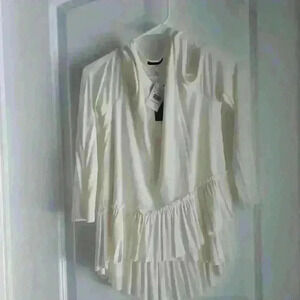 Ivory,  women's,  cold shoulder top. Sz med by Soprano. NWT from Dillard's.